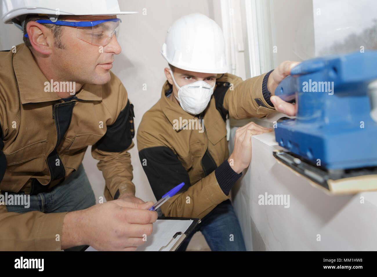 grading the young builders performance Stock Photo