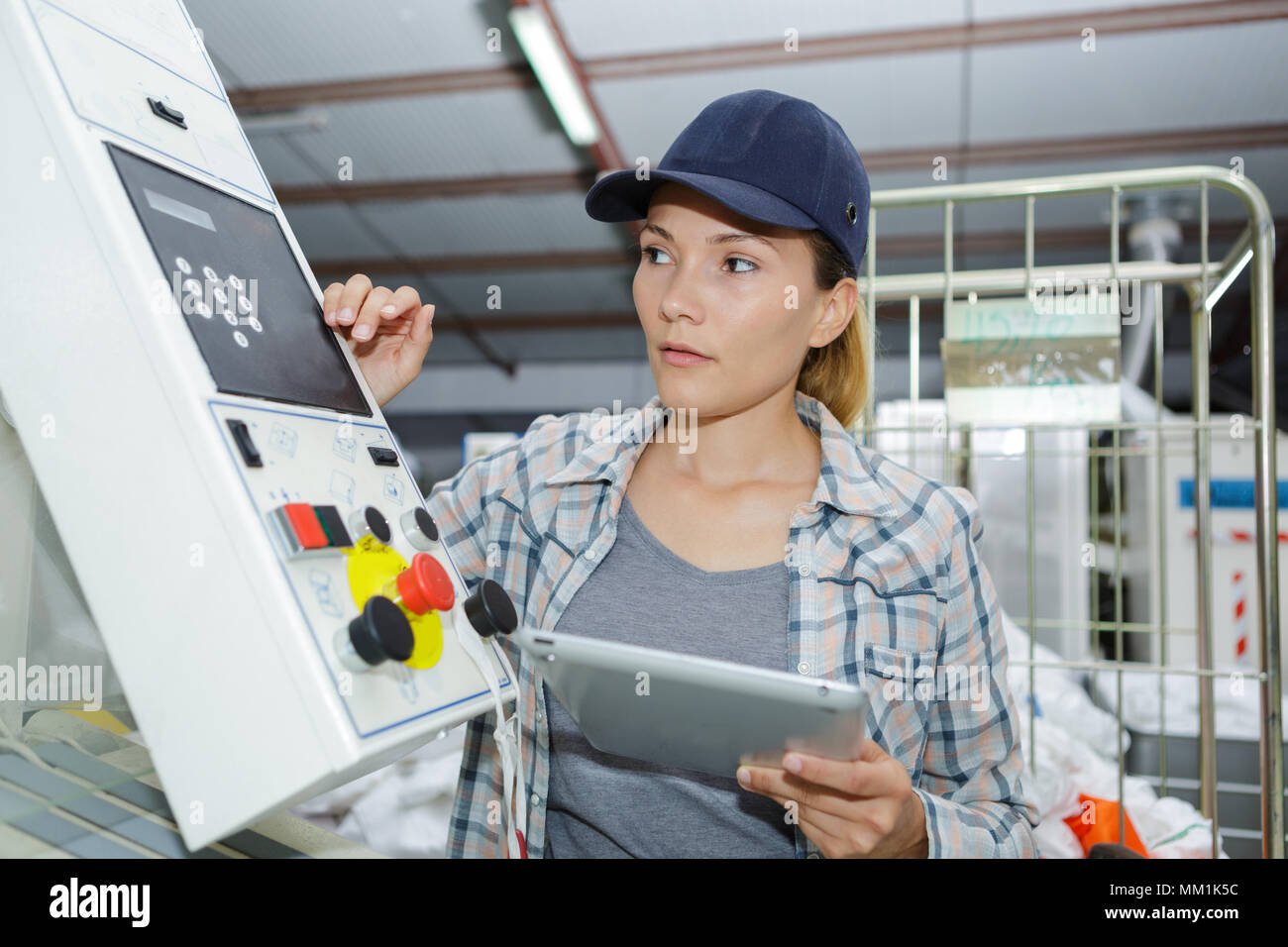 woman control buttons machine factory operator Stock Photo - Alamy