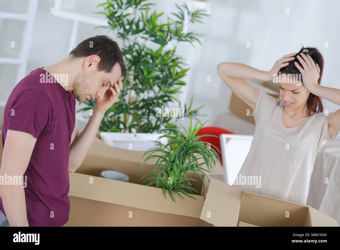 young couple is tired because of packing up Stock Photo