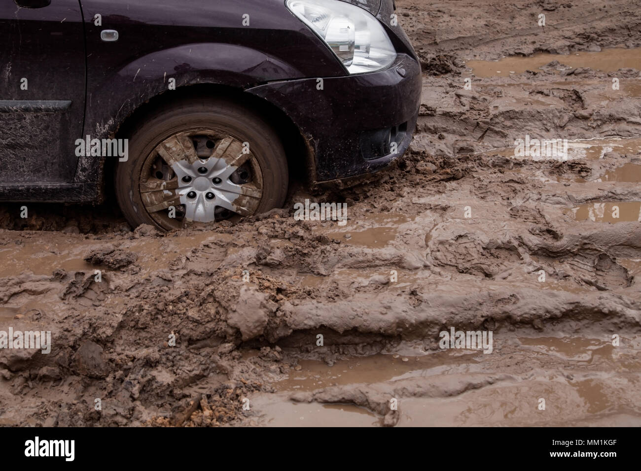 Car Stuck In Mud Muddy Stock Photos & Car Stuck In Mud Muddy Stock