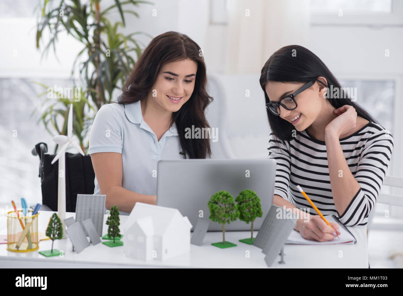 Happy female engineers transferring data Stock Photo Alamy