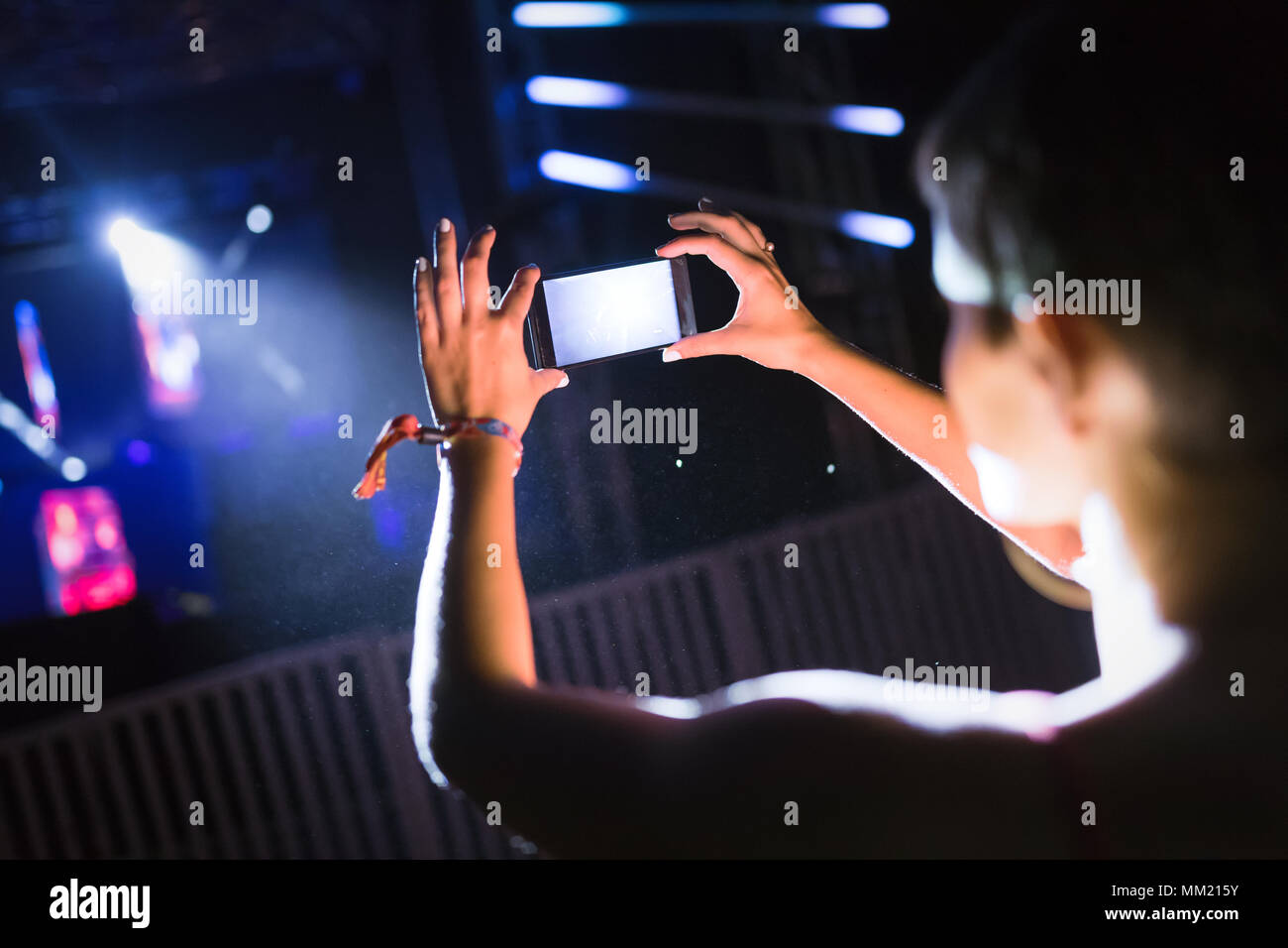 Picture of woman recording music performance at festival Stock Photo