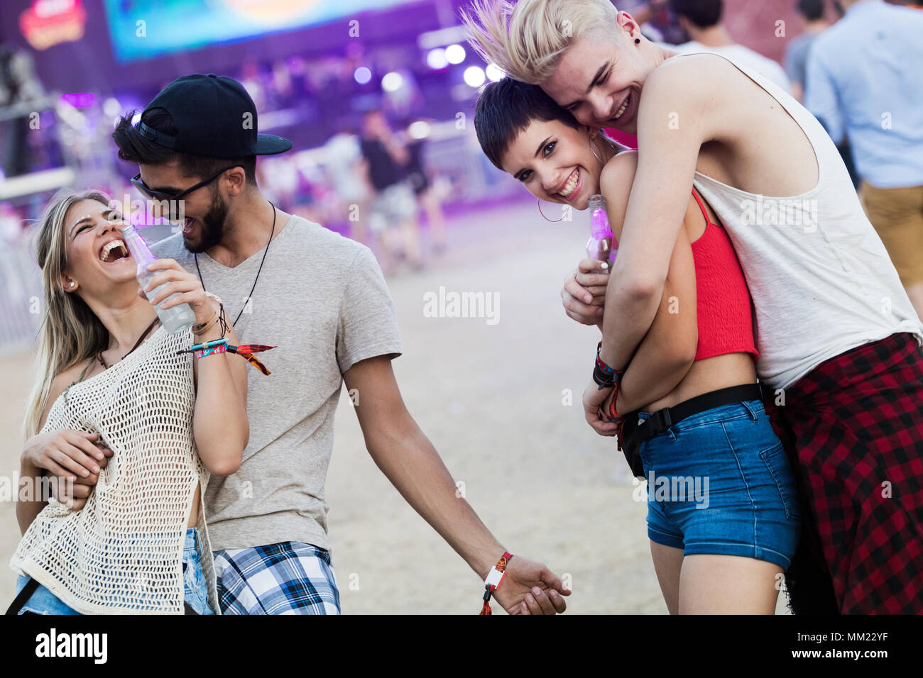 Happy friends having fun at music festival Stock Photo - Alamy