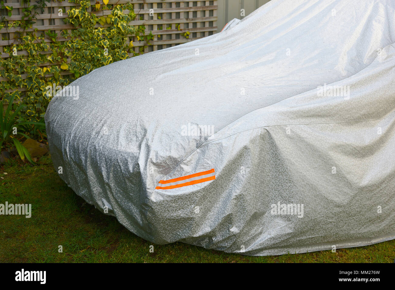 car under cover in residential driveway Stock Photo Alamy