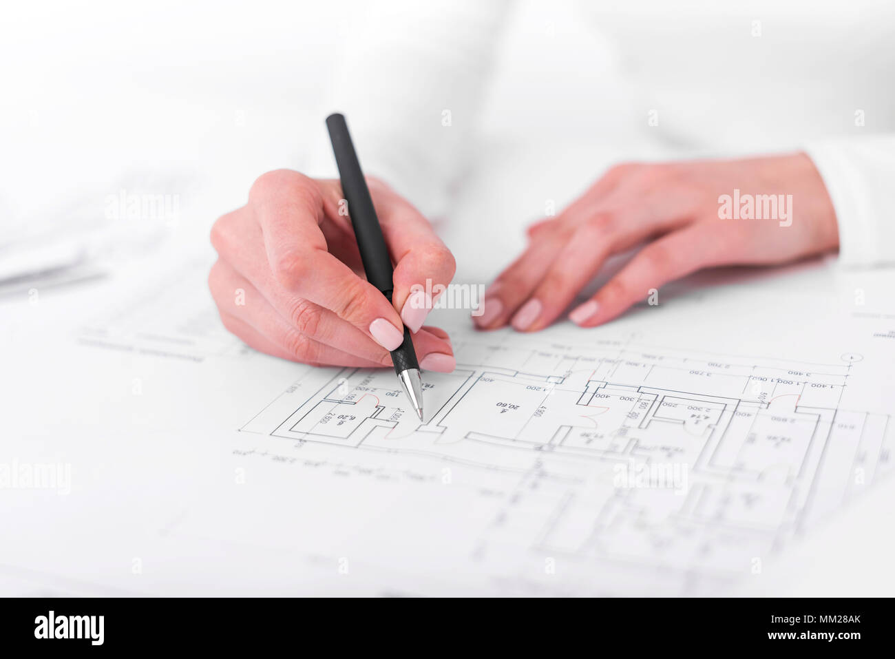 Engineer works with drawings Stock Photo Alamy
