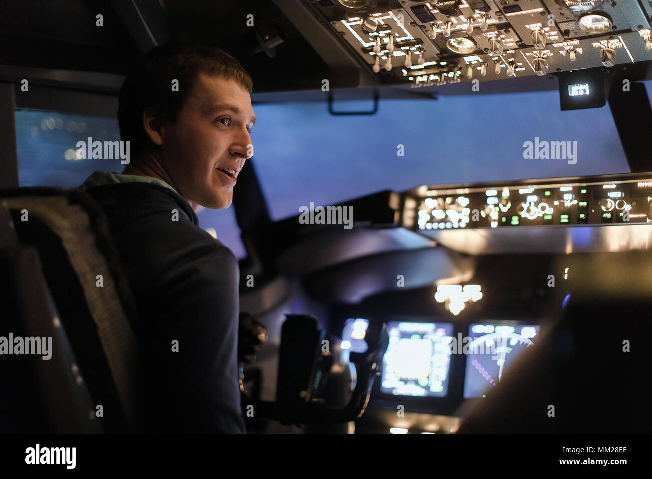 Man pilot plane flight simulator pilots training Stock Photo