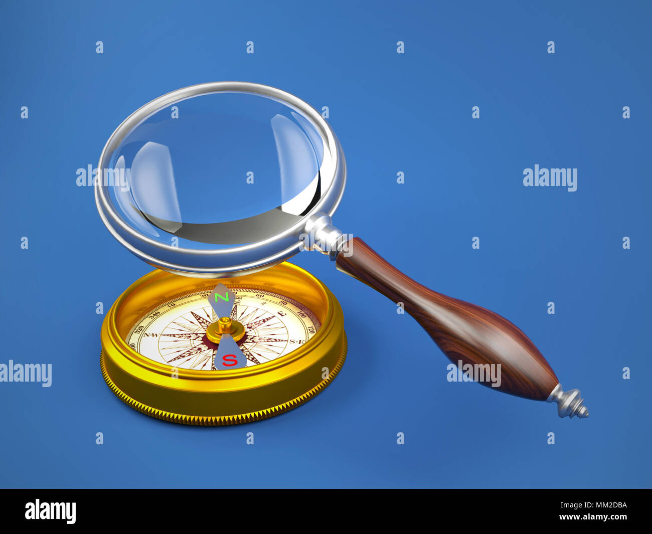 Magnifying glass investigate golden compass Stock Photo Alamy