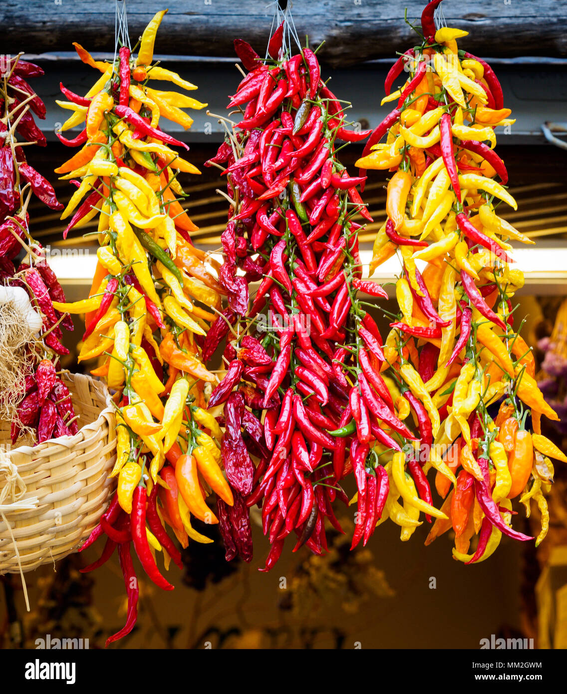 Peppers hanging on fruit & veg stall Stock Photo - Alamy
