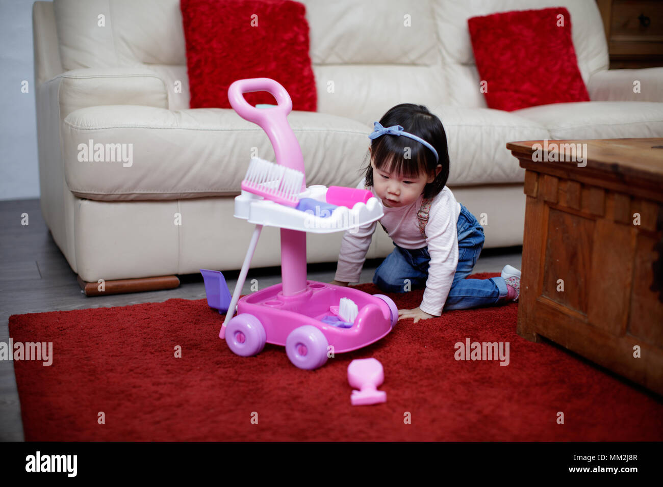 baby girl pretend play at home Stock Photo - Alamy