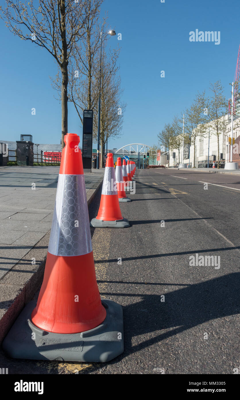 Cones by the side of the road demonstrating no parking allowed Stock Photo