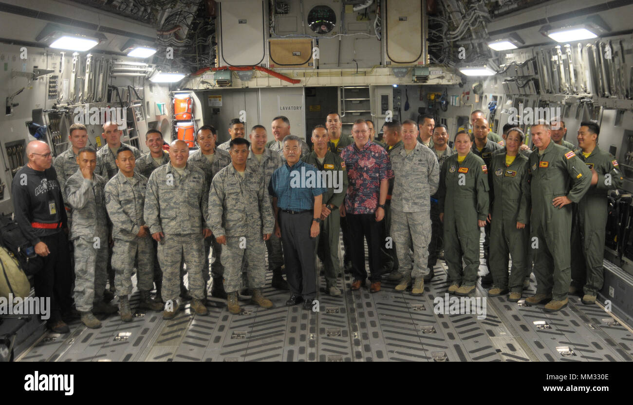 Governor of Hawaii, David Y. Ige, visited with a Hawaiʻi Air National Guard C-17 Globemaster III transport aircraft from the 204th Airlift Squadron, 154th Wing, before they departed Joint Base Pearl Harbor-Hickam early this morning as part of the nation’s Hurricane Harvey relief effort. The C-17, carrying two flight crews and maintenance personnel (16 Airmen in total) will initially fly to Memphis International Airport in Tennessee, from where they will transport relief supplies to the hurricane-damaged areas around Houston, Texas. Hurricane Harvey is one of the worst natural disasters in U.S. Stock Photo
