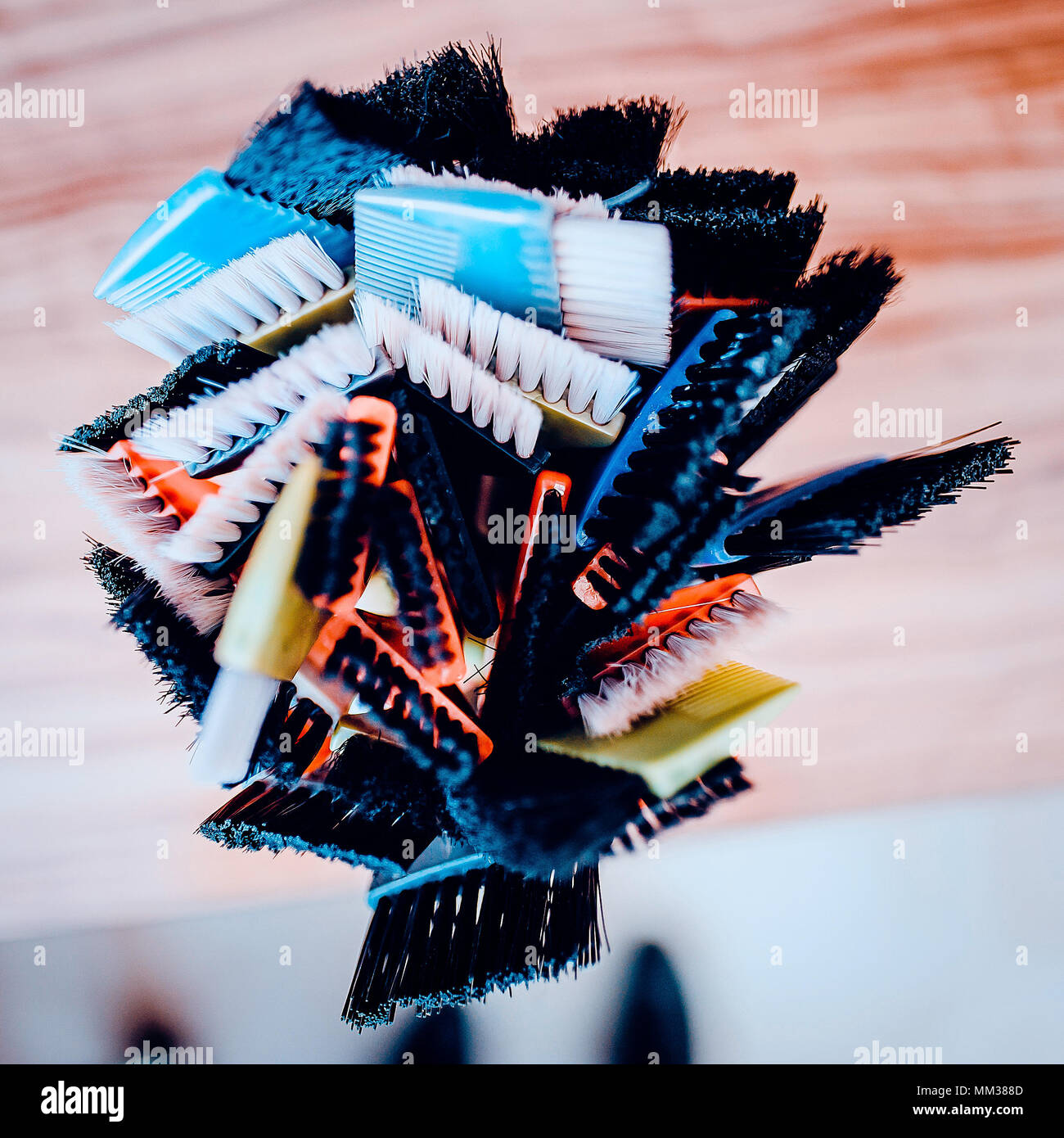 Professional hairdresser tools on table. Toned image. Many brushes for dyeing hair in a glass Stock Photo