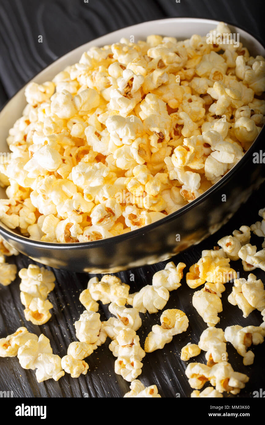 popcorn cheese in a bowl closeup on a table. vertical Stock Photo