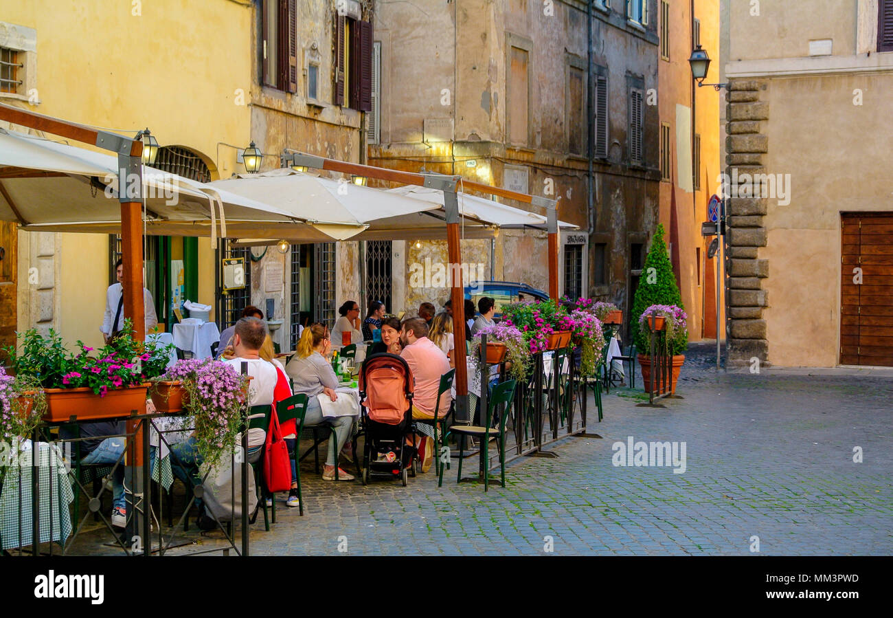People at a terrace of restaurant at Piazza Margana, rome italy Stock Photo