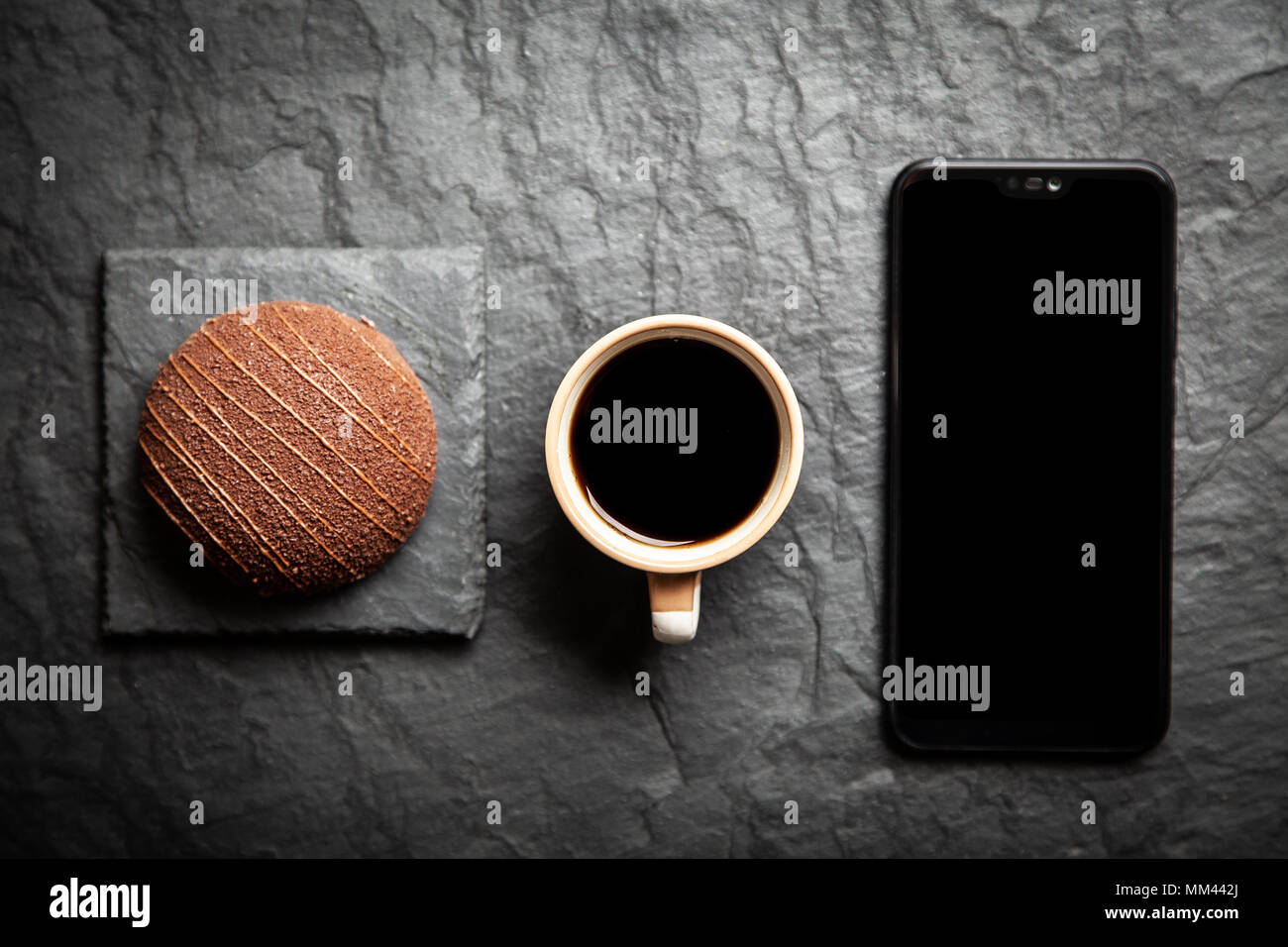 Coffee, dessert and a smartphone Stock Photo