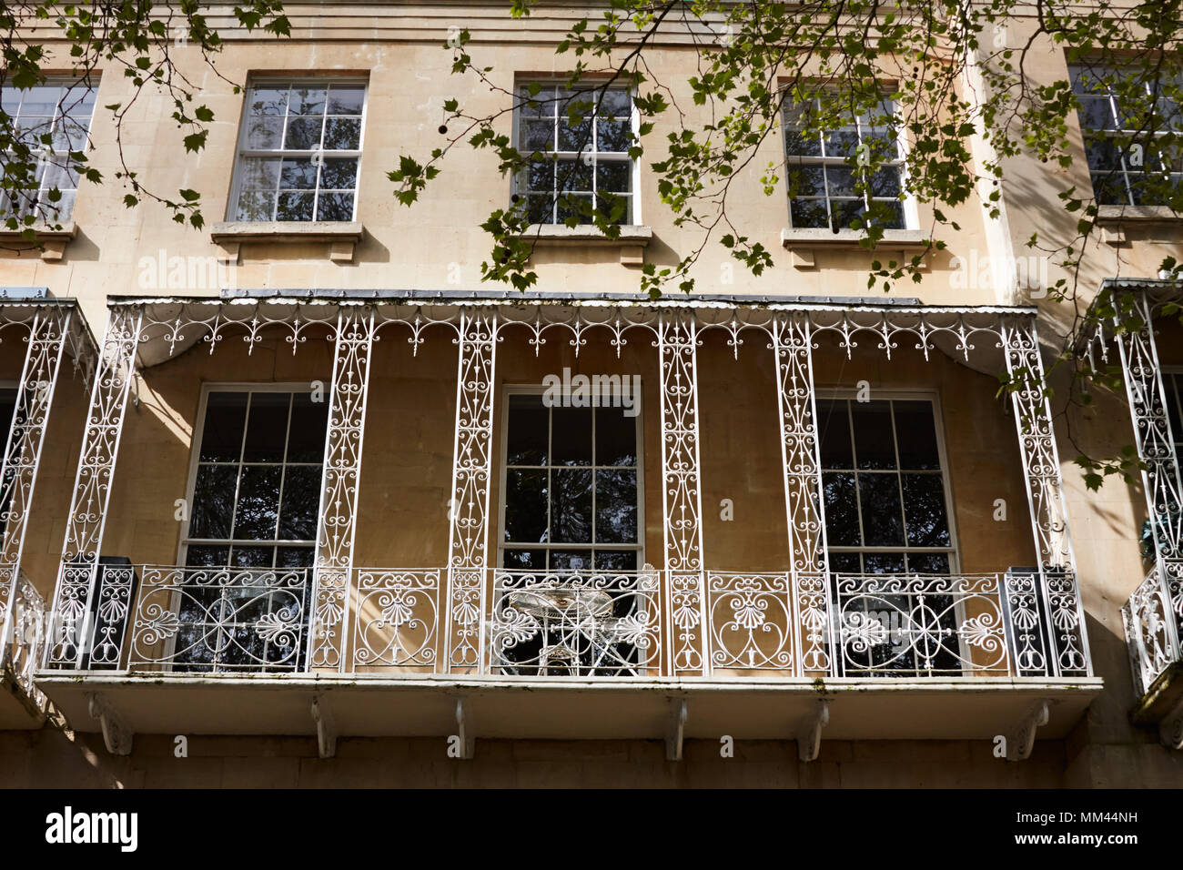 White metalwork balcony on the front of a regency house. Queens Parade