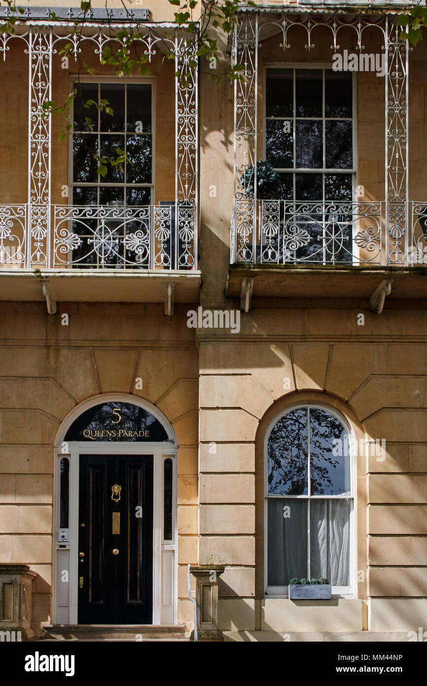 regency style buildings on Queens Parade, Cheltenham, Gloucestershire. Black door sash windows, and ornate balconies. Stock Photo