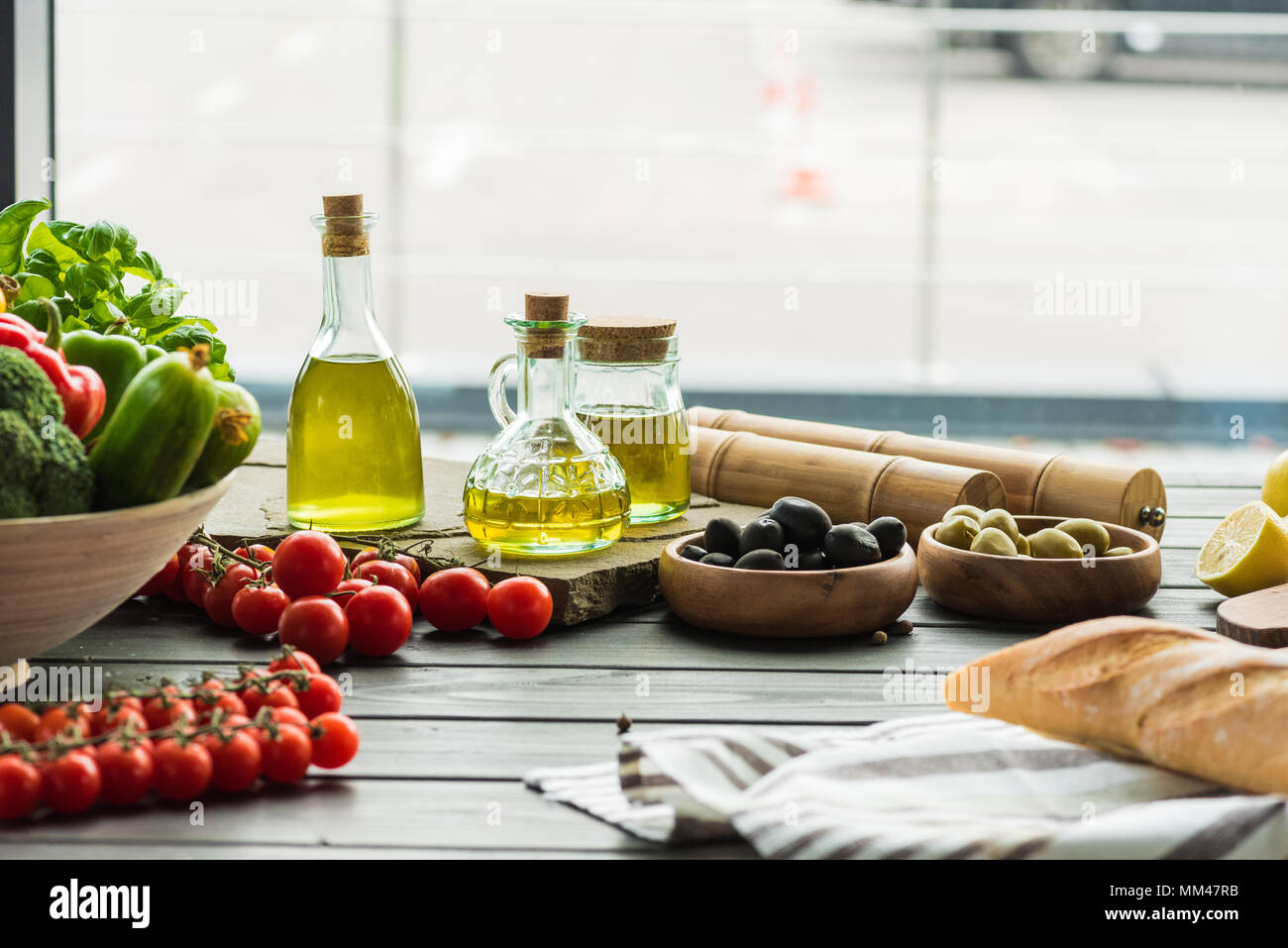 olive oil bottles with vegetables Stock Photo Alamy
