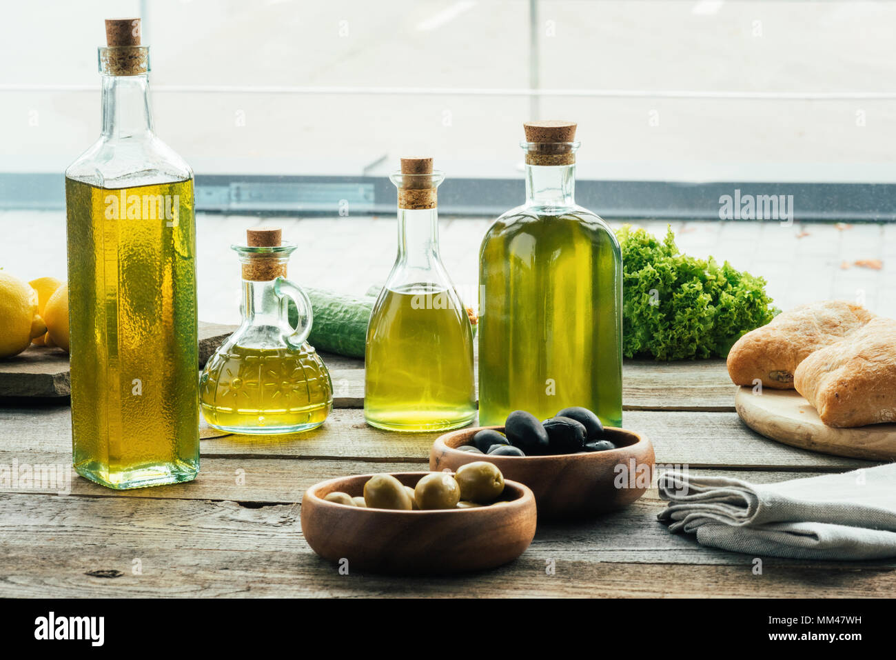 olive oil bottles with vegetables Stock Photo Alamy