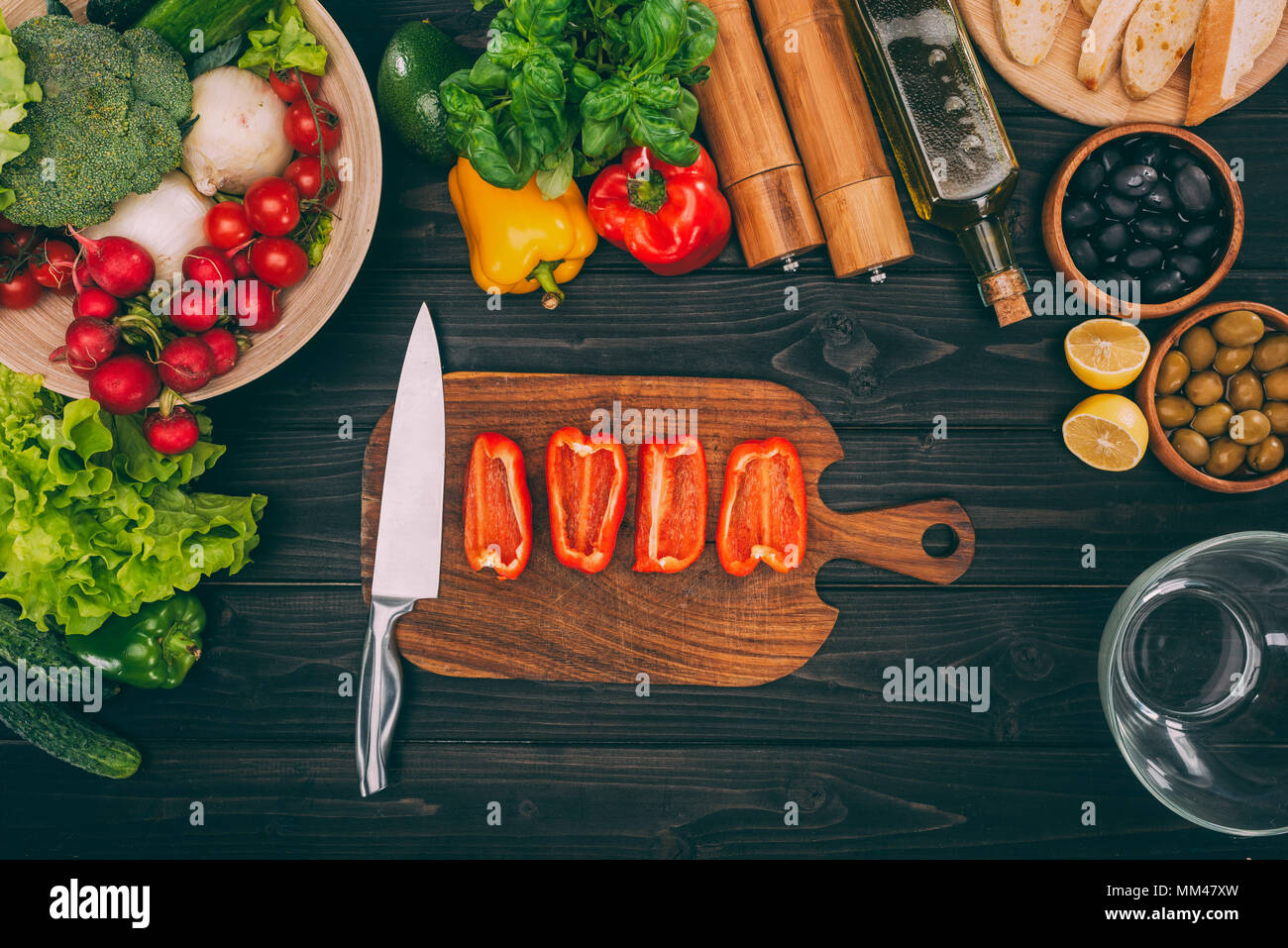 pepper with knife on chopping board Stock Photo - Alamy