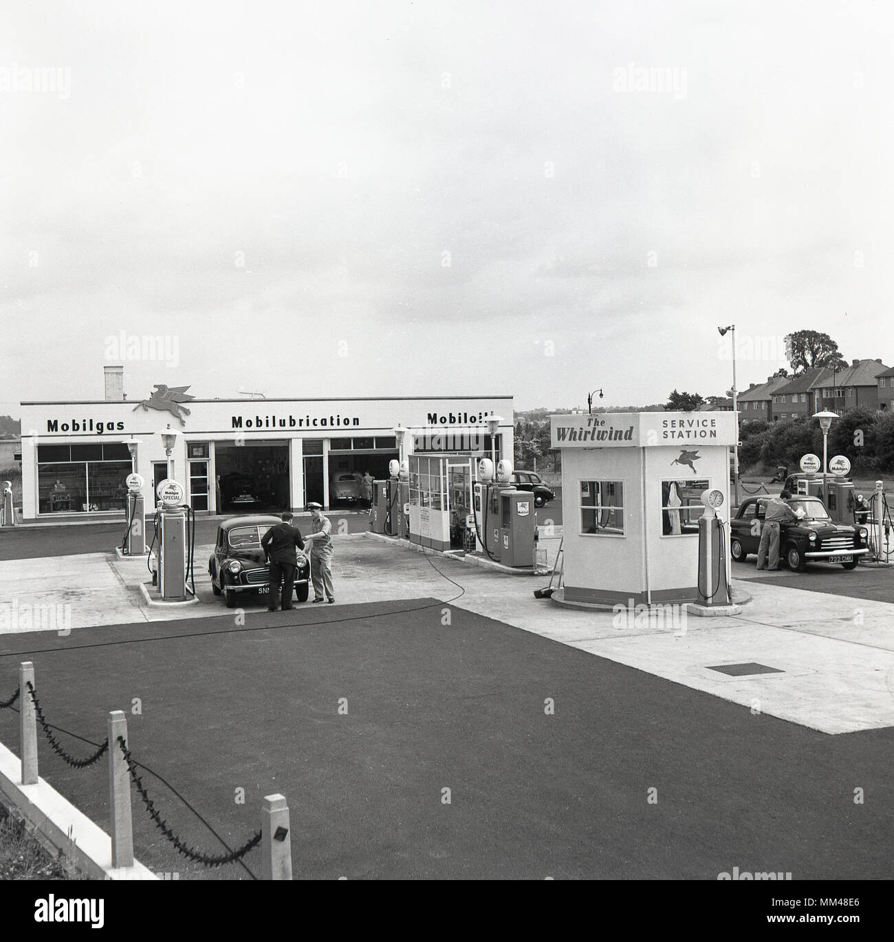 1960, historical picture, exterior, of The Whirlwind, a Mobilgas full service station with repair garage on-site, and with forecourt attendants available to give assistance to customers at the petrol pumps, West London, England, UK. Stock Photo