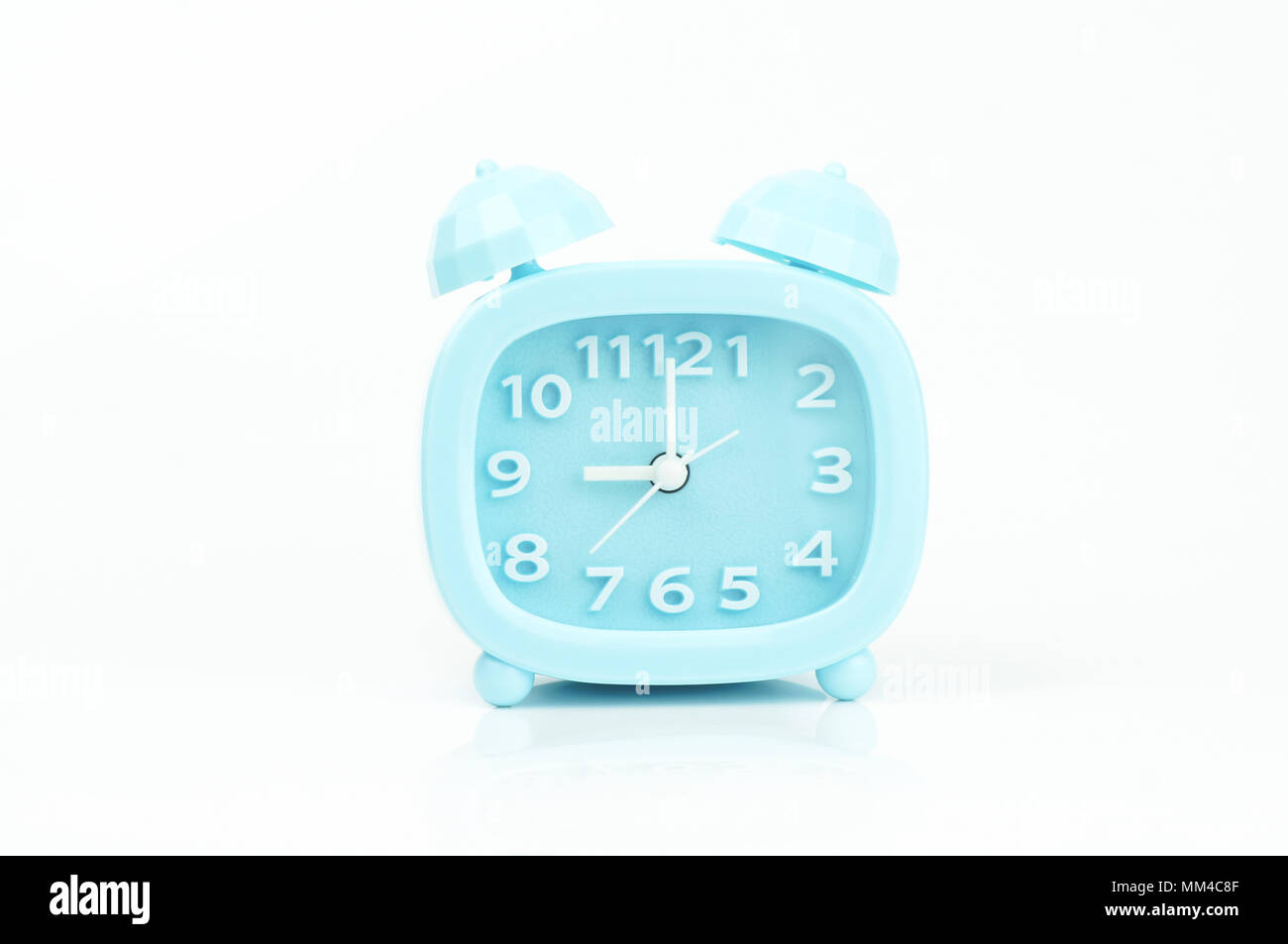 soft blue alarm clock isolated on white background Stock Photo Alamy