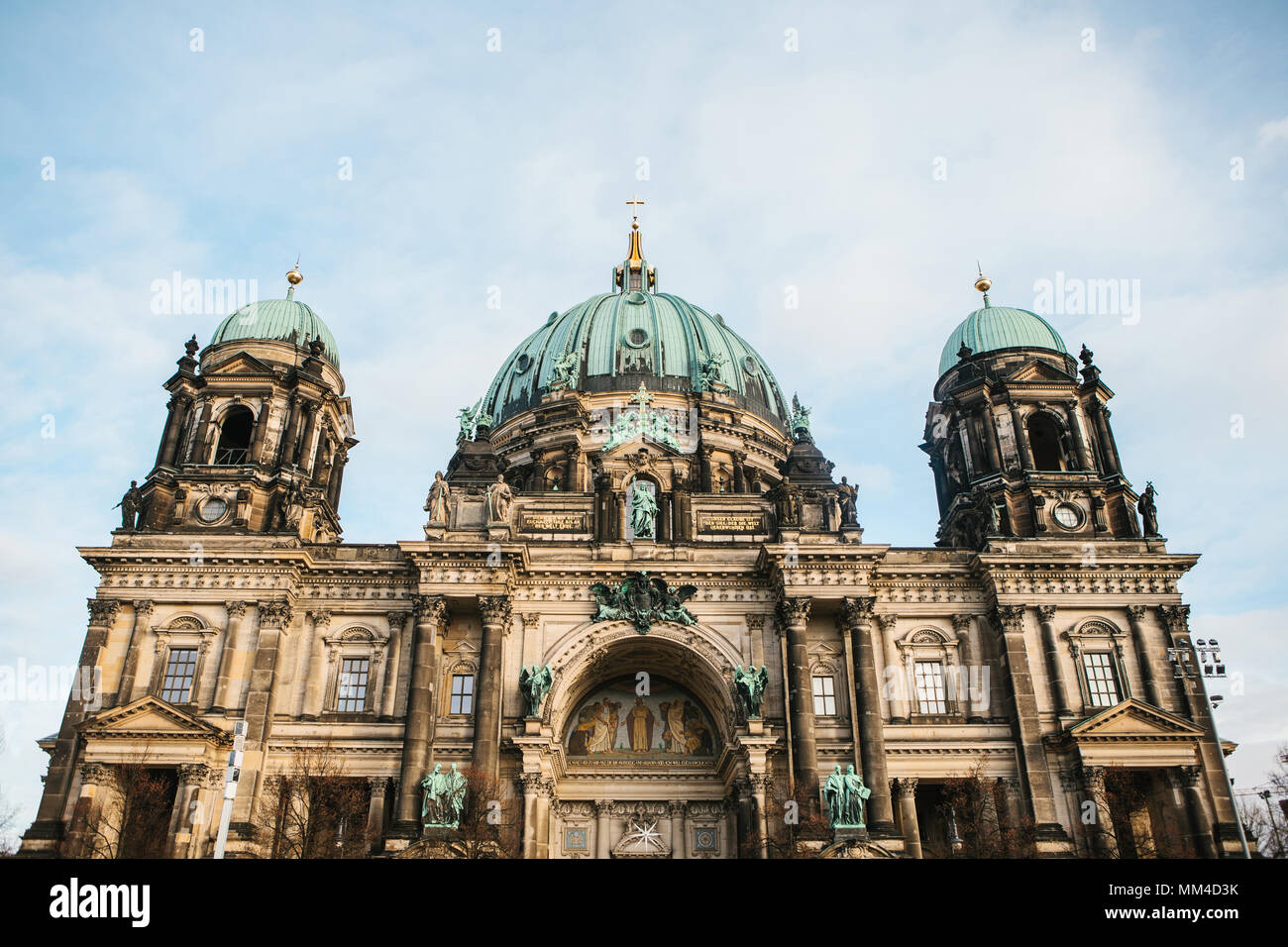 Beautiful old building in the style of neoclassicism and baroque with cross and sculptures Stock Photo