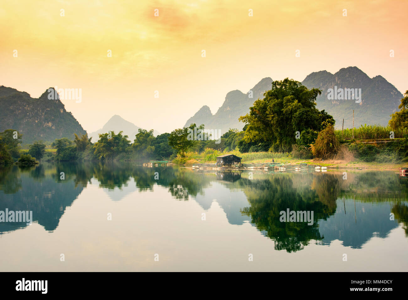 Scenic sunset over a lake in Guangxi province of China Stock Photo
