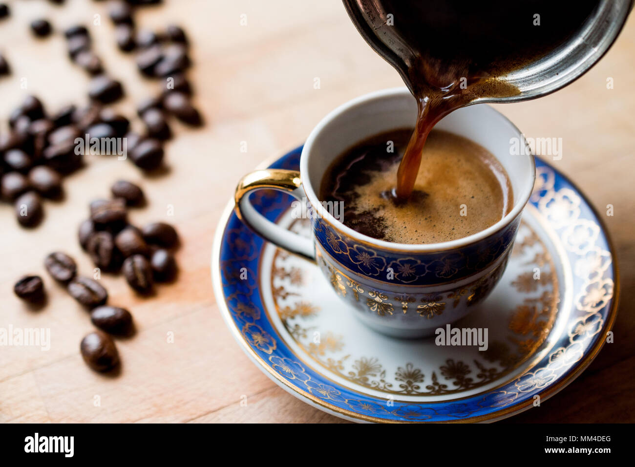 https://c8.alamy.com/comp/MM4DEG/pouring-turkish-coffee-into-traditional-cup-traditional-beverage-MM4DEG.jpg