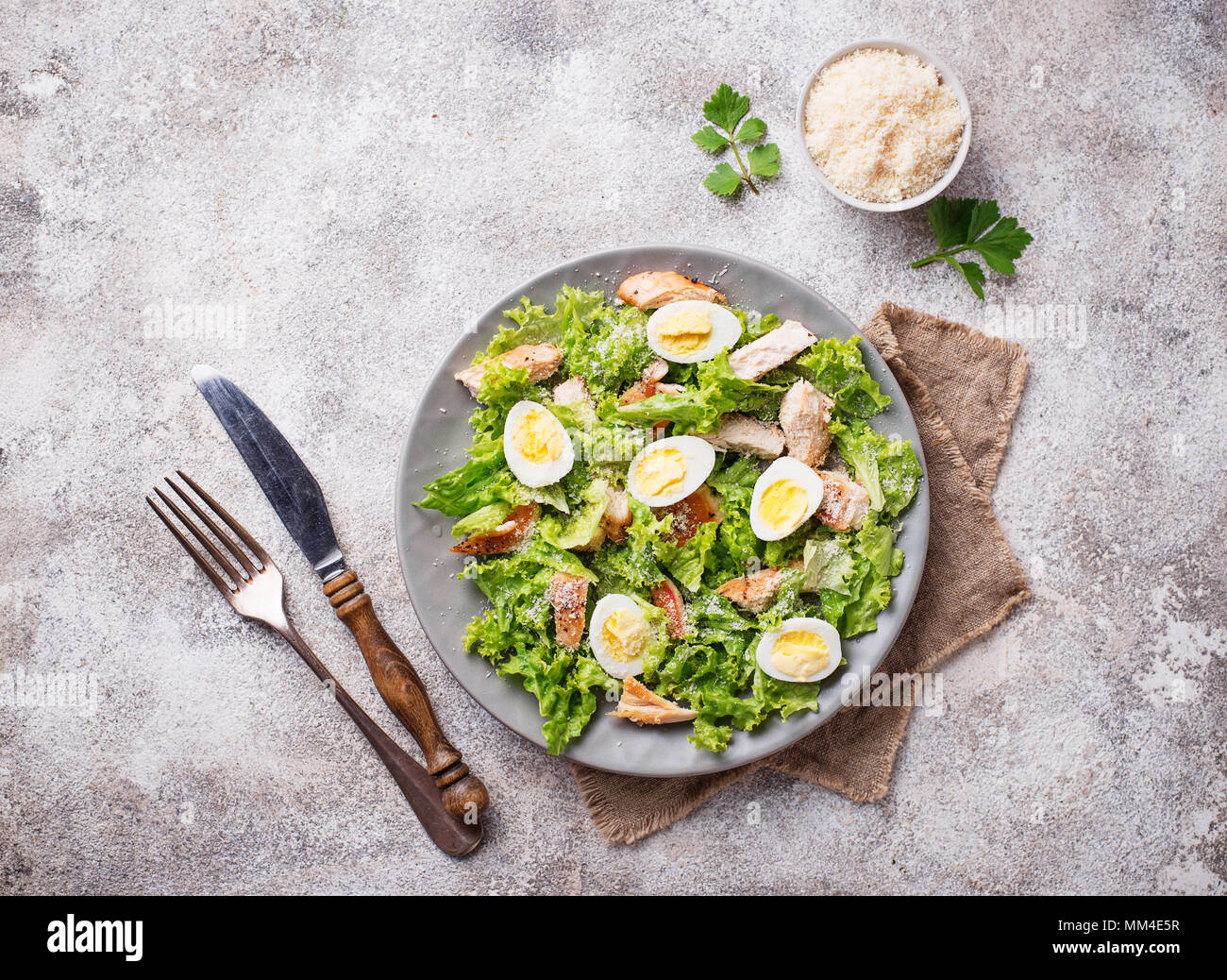 Caesar salad with eggs, chicken and parmesan Stock Photo