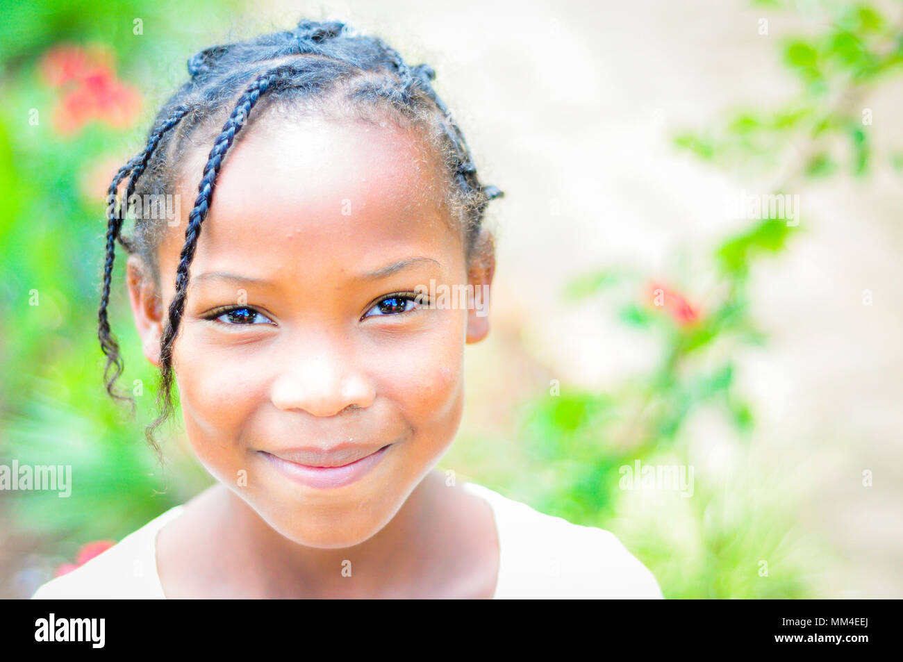 Unknown kid just look into the camera with his dark eyes. Fianarantsoa, Madagascar Stock Photo