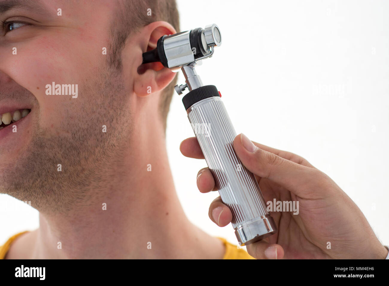 Doctor examining patients ear in doctors office Stock Photo Alamy