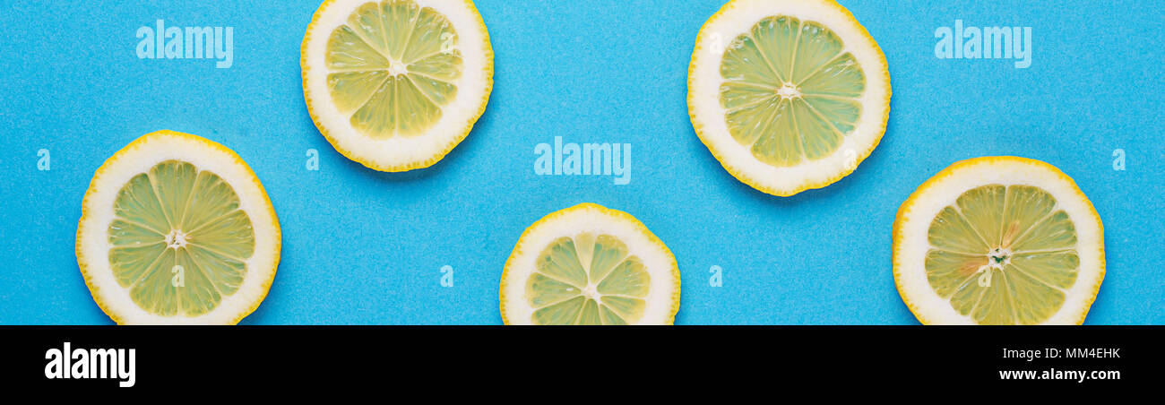 Sliced lemon on blue background Stock Photo