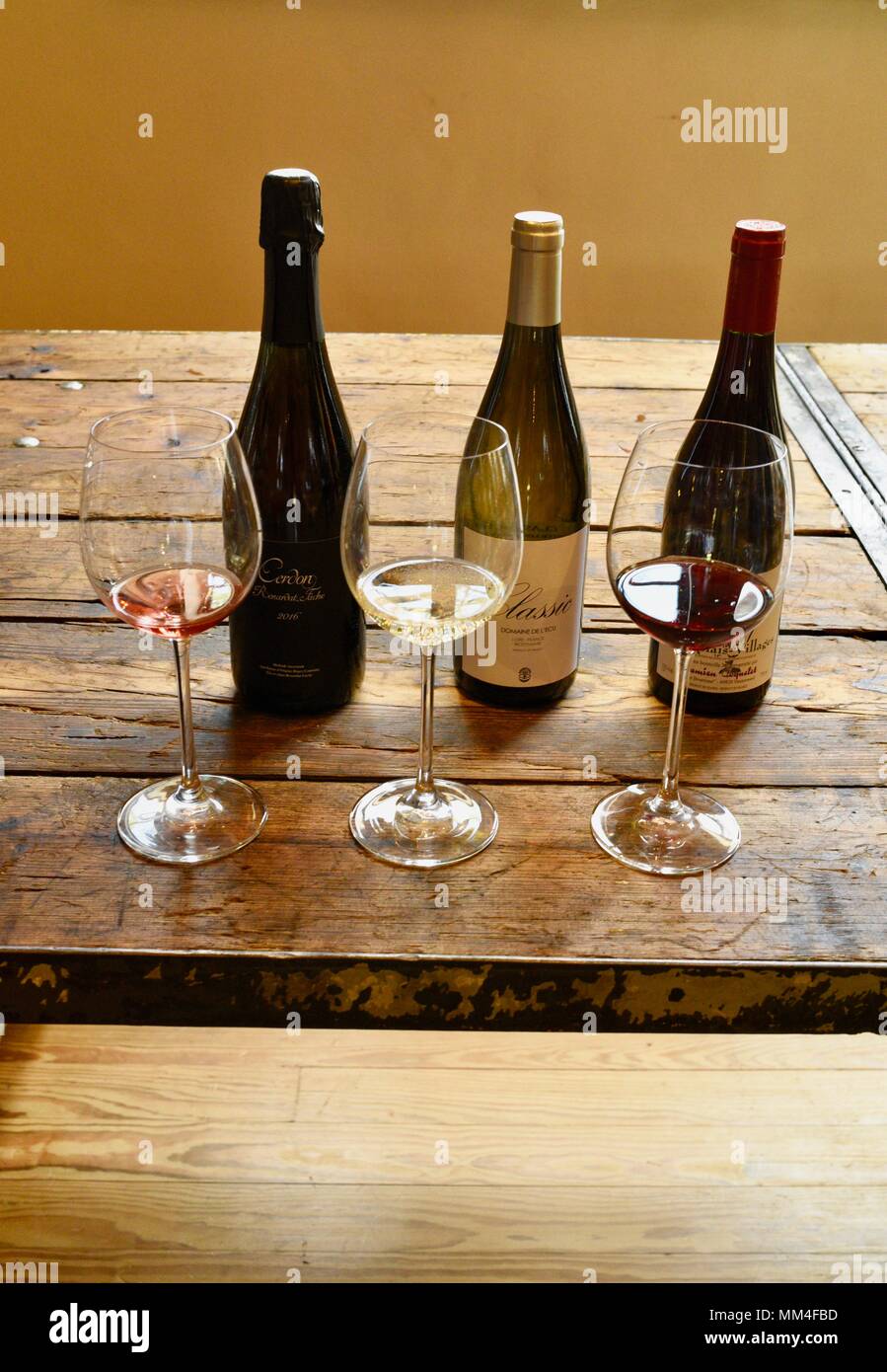 Fine wines on display at tasting, white, rose and red wine with bottles