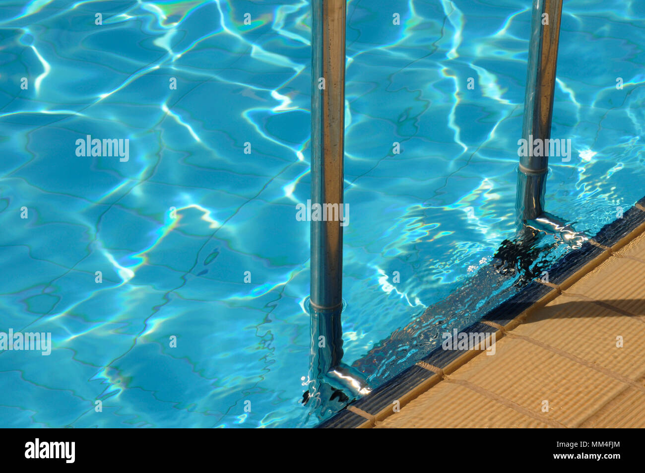 Swimming pool grab bars ladder closeup Stock Photo Alamy