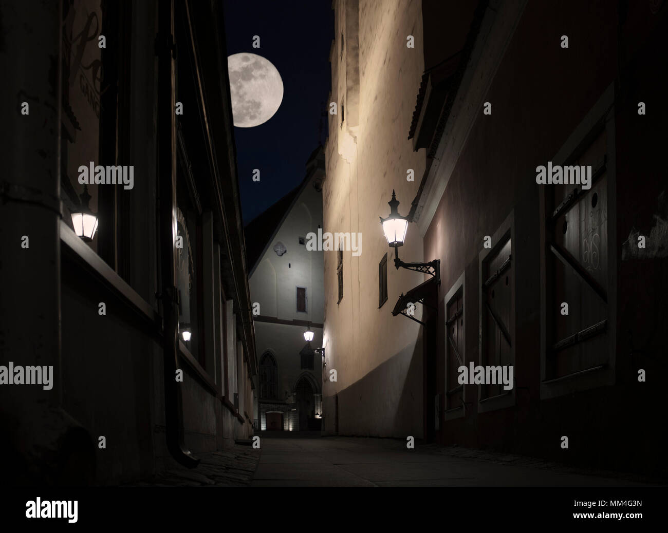 Street in the old medieval town of Tallinn at night with the moon Stock ...