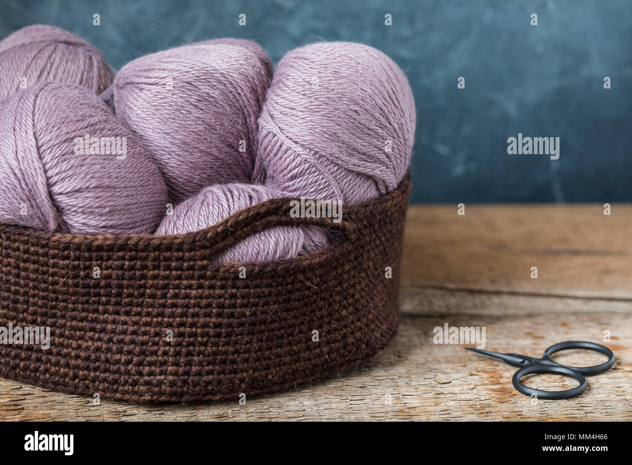 Knitting Pink Wool Yarn In The Crocheted Basket Stock Photo Knitting Pink Wool Yarn In The Crocheted Basket Stock Photo