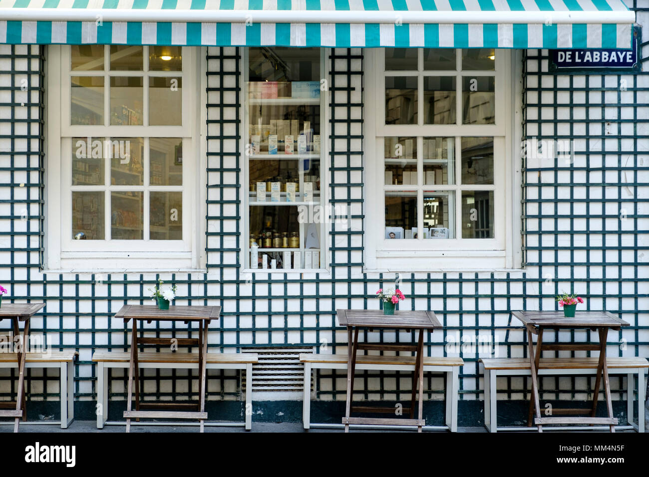 Cafe facade on street with tables and no people, Paris, France, Stock Photo