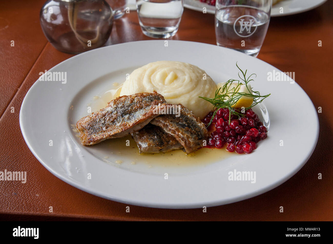 BALTIC HERRING fried with mashed potatoes and lingonberry 2018 Stock Photo