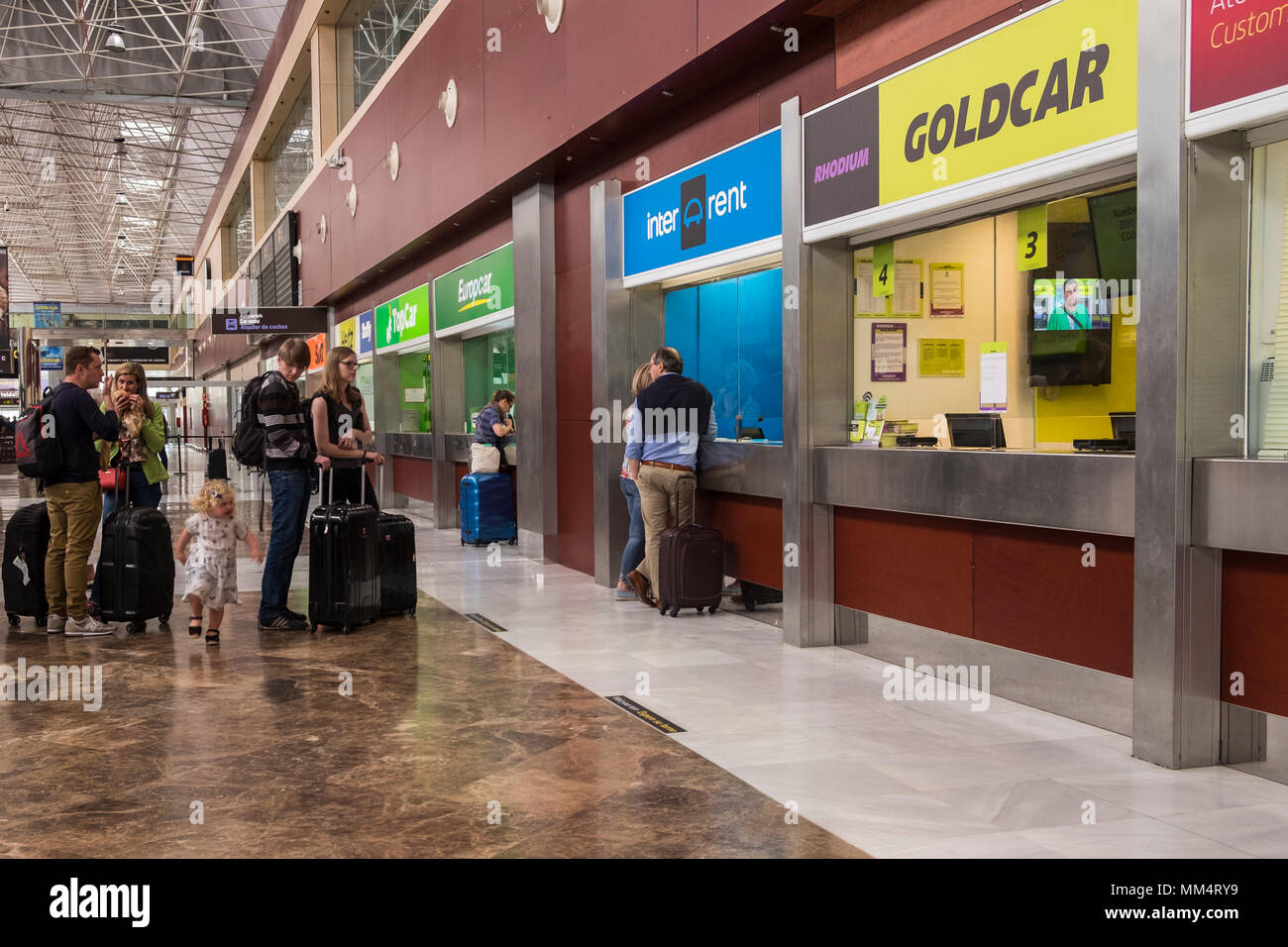 Queueing for car rental at the offices in the arrivals hall at Tenerife Sur, Reina Sofia, airport, Canary islands, Spain Stock Photo