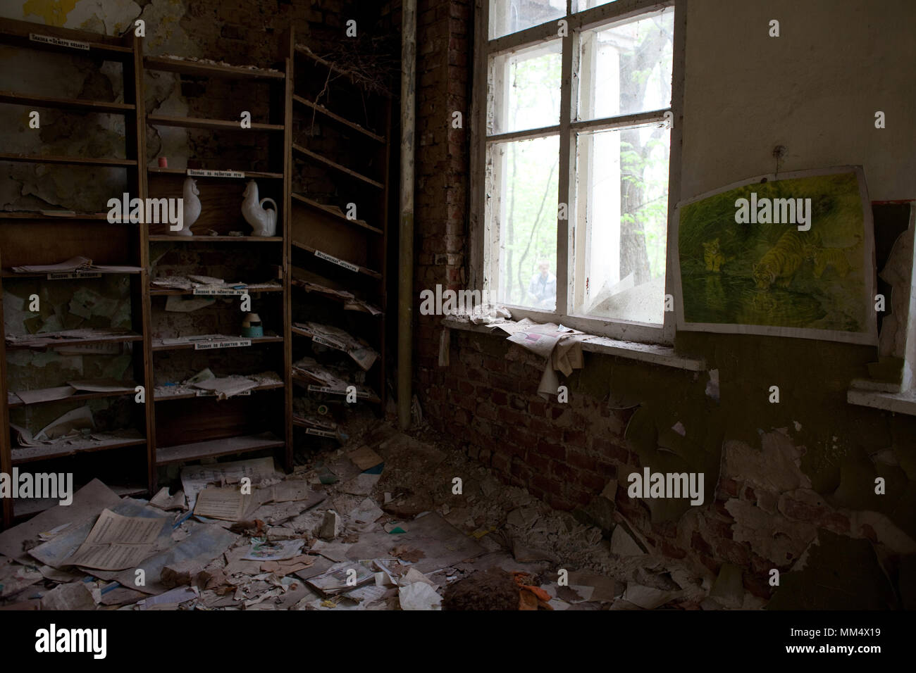 Ruined buildings and rooms, broken shelves, glass, Chernobyl 30km Exclusion Zone, northern Ukraine Stock Photo