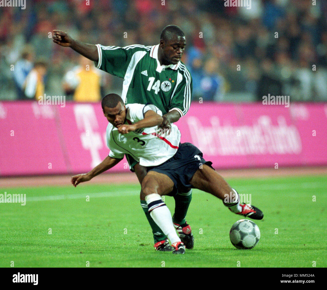 Football: Olympia Stadion Munich Germany 1.9.2001, FIFA World Cup 2002 qualifier Germany (green) vs England (white) 1:5 ---- Gerald ASAMOAH and Ashley COLE Stock Photo