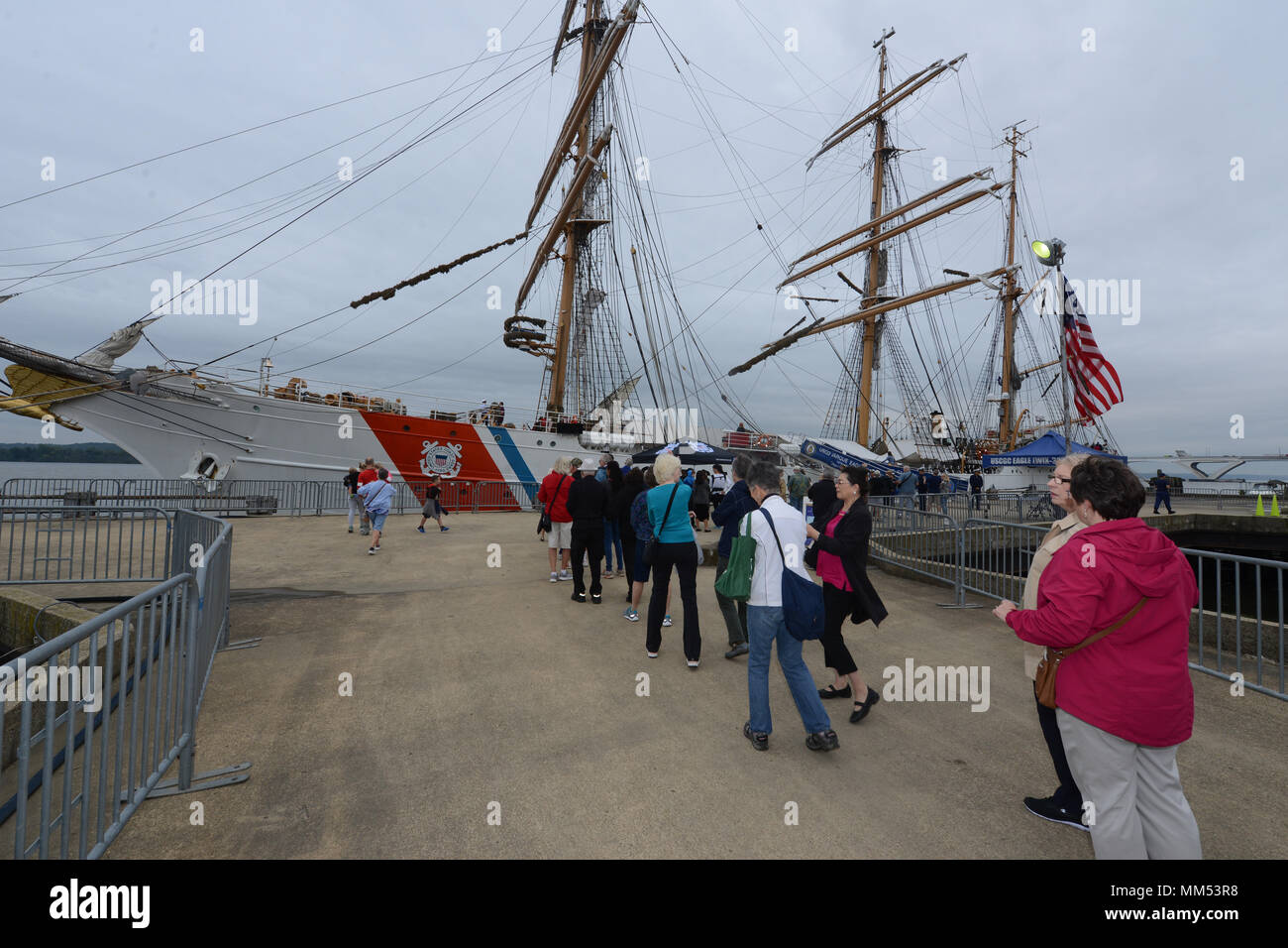 Members of the public wait in line to tour the Coast Guard Cutter