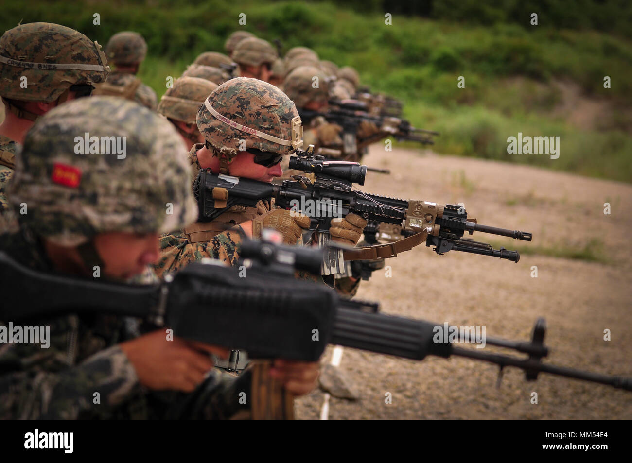 Lance Cpl. Brendan I. Strain, a Valdosta, Georgia native and rifleman assigned to Charlie Company, 1st Battalion, 3rd Marine Regiment, engages targets during Korean Marine Exchange Program (KMEP) 17-13 aboard Suesongri live fire range, Republic of Korea, Sept. 4, 2017. KMEP 17-13 enables the Republic of Korea and U.S. Marines to focus on exchanging tactics, procedures, and increasing interoperability. The Hawaii-based battalion is forward deployed to Japan as part of the Unit Deployment Program. (U.S. Marine Corps Photo by Cpl. Aaron S. Patterson) Stock Photo