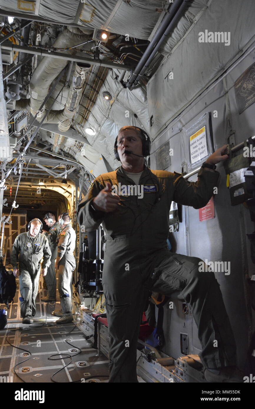 Maj. Phillip Angelo a North Carolina Air National Guardsman, prepares for takeoff prior to the departure of the C-130 to Key West Florida, to aid in medical evacuations prior to the arrival of Hurricane Irma, while at the North Carolina Air National Guard Base, Charlotte Douglass International Airport, Sept. 6, 2017. The guardsman assisted with the transfer of eleven patients from the Lower Keys Medical Center in Key West Florida, to the Gadsden Alabama Regional Medical Center. Stock Photo