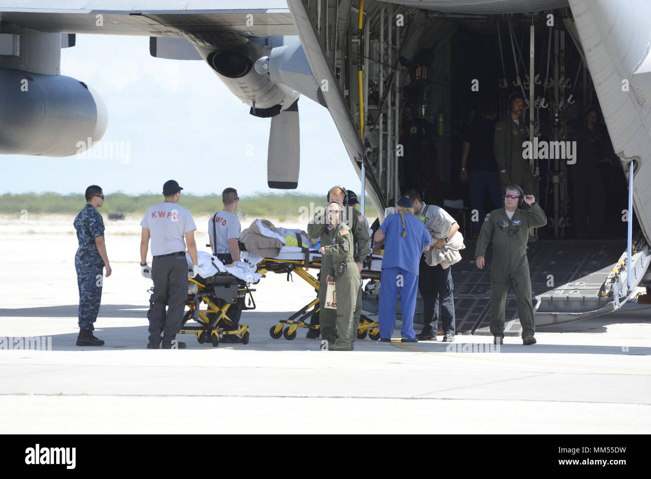 A patient from the Lower Keys Medical Center in Florida is loaded onto a North Carolina Air National Guard C-130 that arrived to assist with evacuation efforts prior to the arrival of Hurricane Irma, while at the Key West Naval Air Station, Key West Florida, Sept. 6, 2017. The patients were evacuated prior to the arrival of Hurricane Irma, a category five storm that is expected to cause catastrophic damage to the regions it makes landfall. The 156th Aeromedical Evacuation Squadron of the North Carolina Air National Guard provides medical care for wounded individuals while transporting them to  Stock Photo