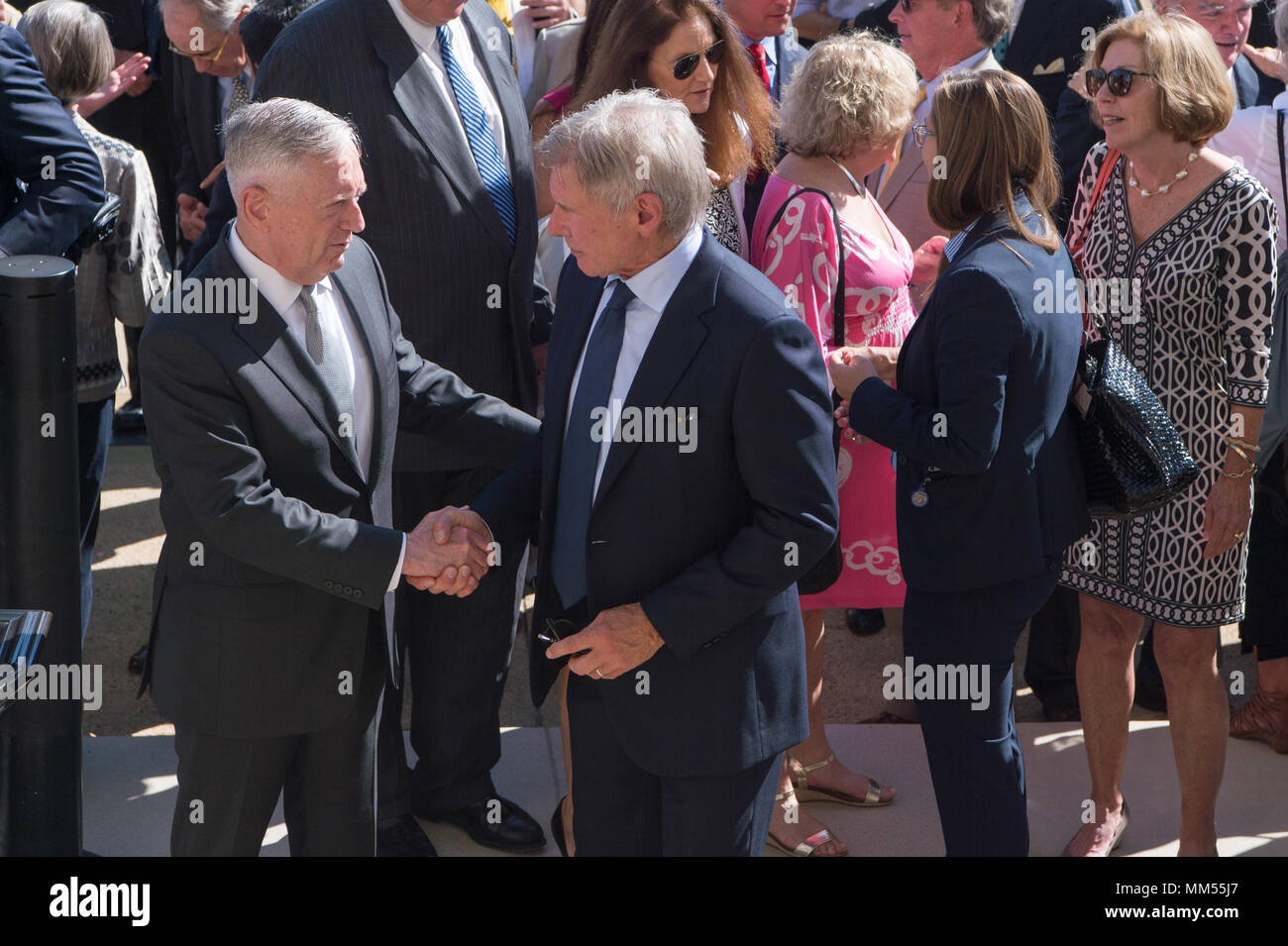 Defense Secretary Jim Mattis shakes hands with Actor Harrison Ford following the formal swearing in of Secretary of the Navy Richard V. Spencer at the Pentagon in Washington, D.C., Sep. 7, 2017. (DOD photo by Army Sgt. Amber I. Smith) Stock Photo