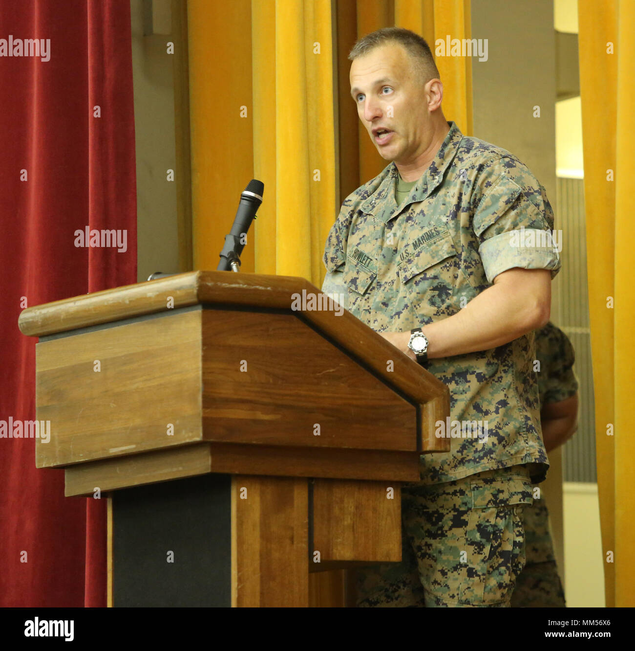Col. Brian M. Howlett, commanding officer, III Marine Expeditionary Force Information Group addresses the crowed during the III Marine Headquarters Group re-designation ceremony at Camp Courtney, Okinawa, Japan on Sept. 8, 2017. III MHG was re-designated in a ceremony as III MEF Information Group, highlighting the beginning of a new era of modern Marine Corps information warfare. (U.S. Marine Corps photo by Lance Cpl. Christian J. Lopez) Stock Photo