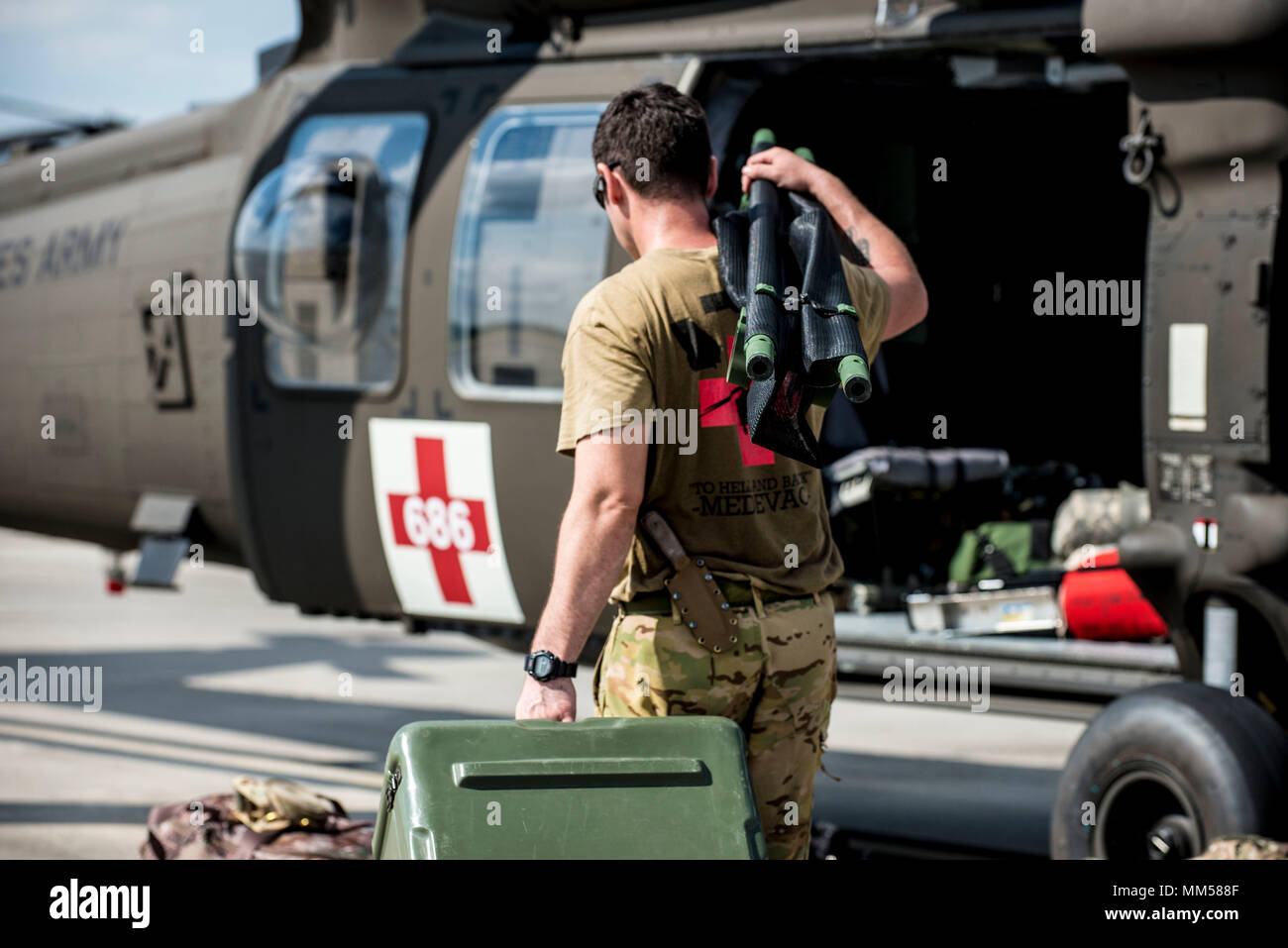 A Soldier with Company C, 1st Battalion, 111th Aviation Regiment loads
