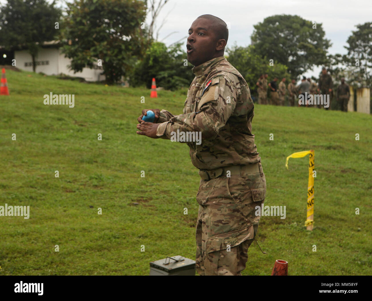 Panamanian Servicio Nacional Aeronaval Cpl. Edwin J. Lasso  prepares to throw a simulation grenade during a combat fitness test conducted by U.S. Marines with  Mobile Training Team One, Command Element, Special Purpose Marine Air-Ground Task Force - Southern Command, at Agustin Santos Vinda Base in Quebrada de Piedra, Panama, Aug. 29, 2017. The MTT conducted a three-week course with Panamanian service members consisting of basic infantry tactics, marksmanship, and patrolling. The Marines and sailors of SPMAGTF-SC are deployed to Central America to conduct security cooperation training and engi Stock Photo